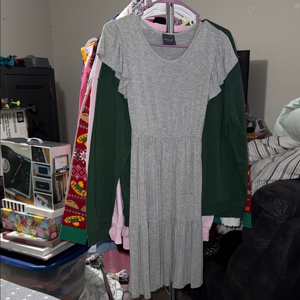Grey flowy dress , hits a little above the knee for length.